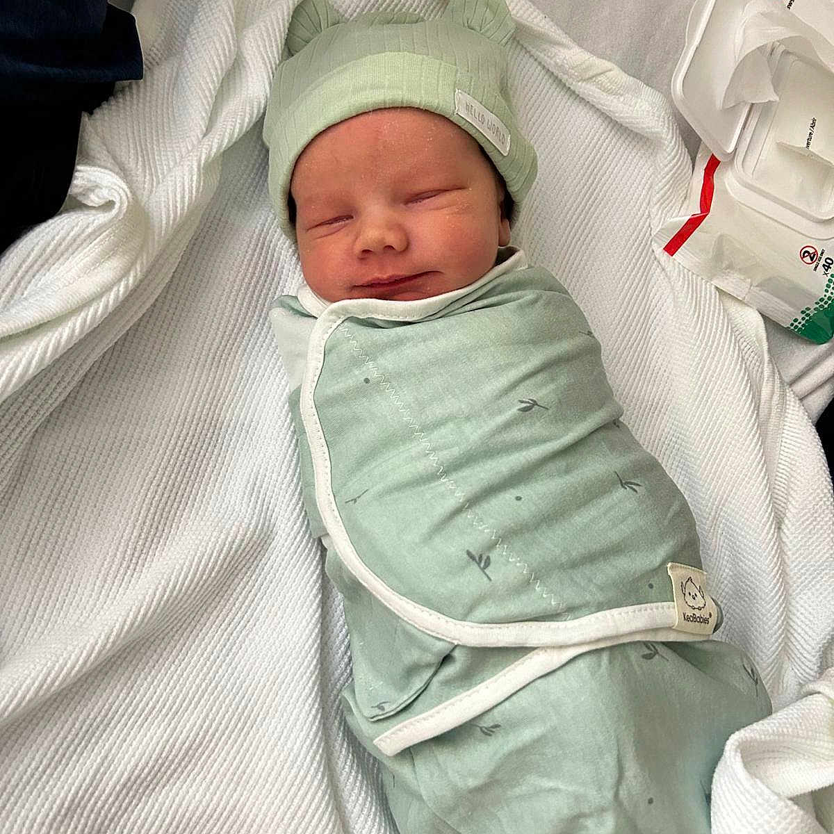 Gideon joined the competition — help win amazing prizes! architecture, baby, blanket, building, childbirth, face, head, hospital, newborn, person, sleeping