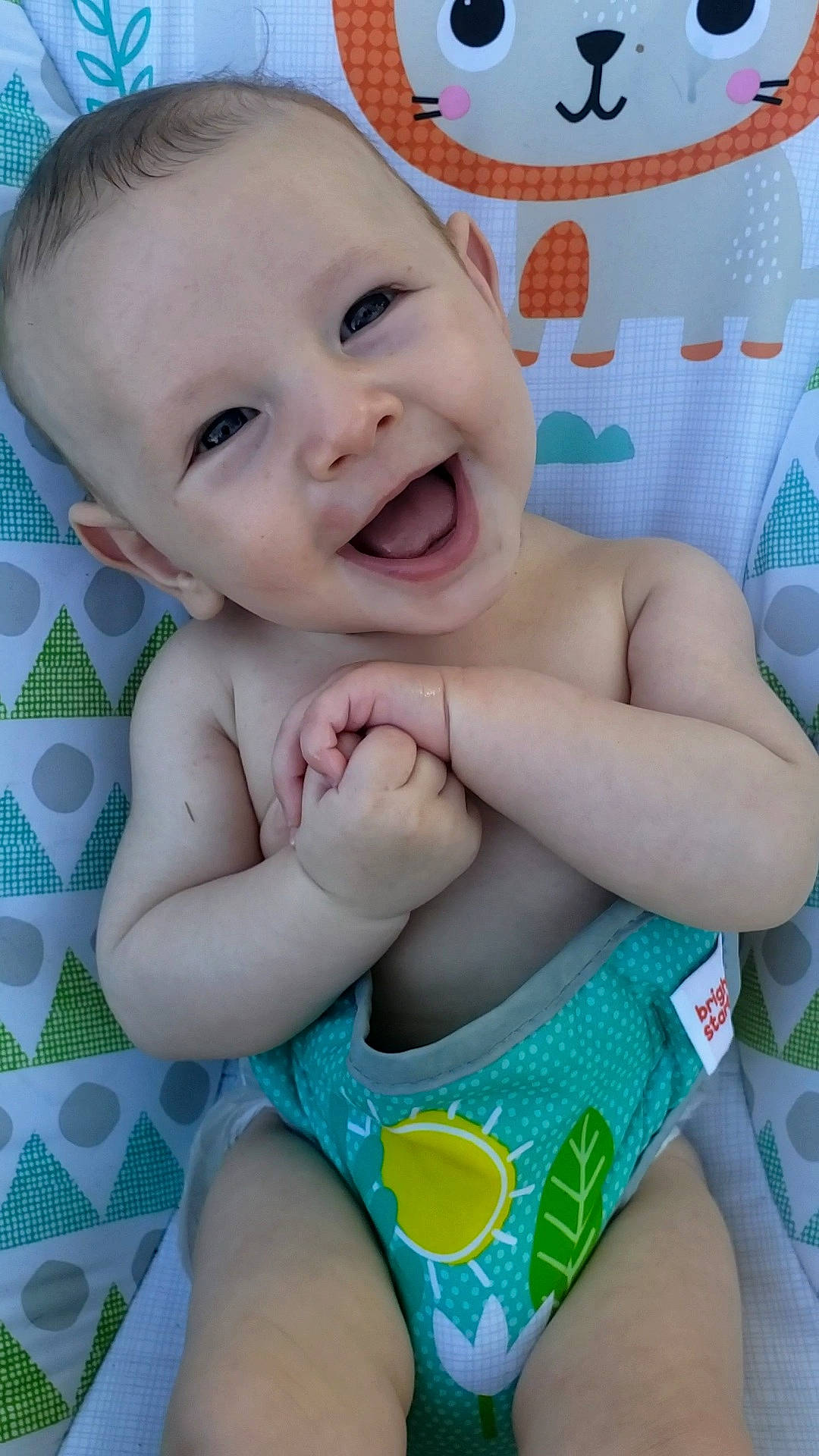 Carter is registered to the contest to win money with this photo: baby_toddler_clothing, blue, cheek, eye, face, facial_expression, gesture, green, happy, head, joy, mouth, muscle, neck, person, photograph, product, skin, smile, stomach