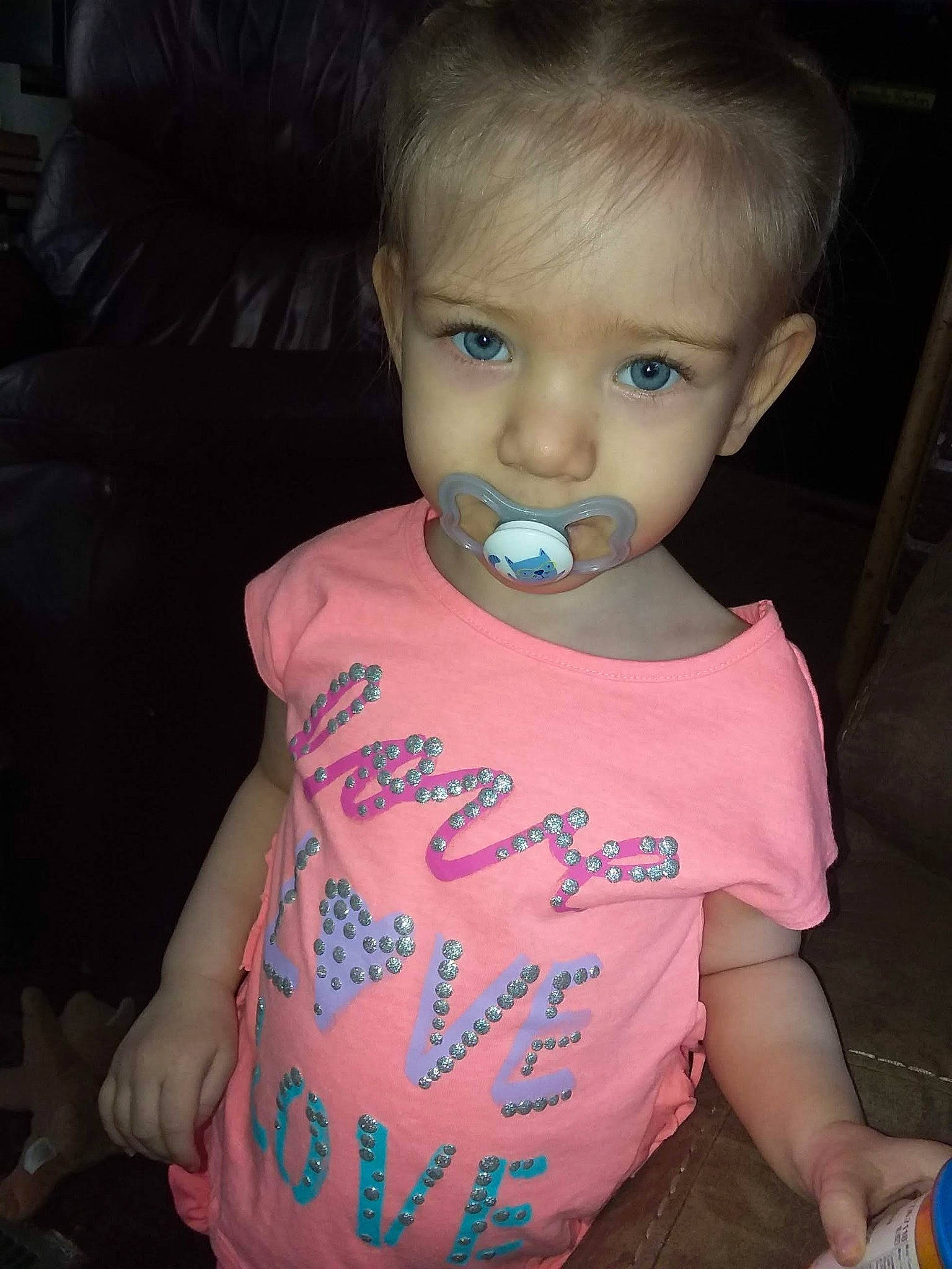 Marlie is registered to the contest to win money with this photo: baby, baby_products, baby_toddler_clothing, cheek, child, eye, face, fun, iris, neck, person, pink, skin, smile, t_shirt, toddler, vacation