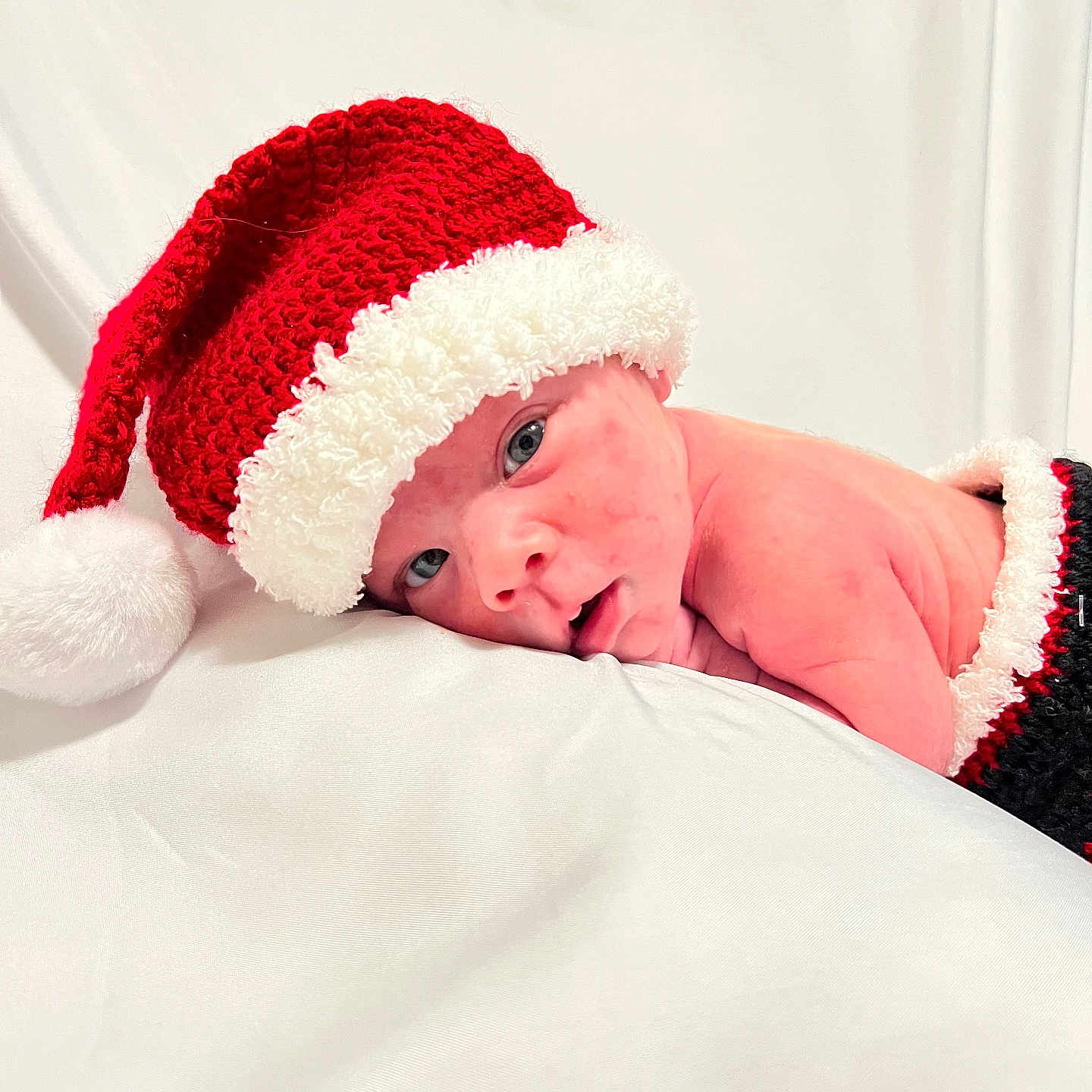 Nolan joined the competition — help win amazing prizes! baby, beanie, blanket, bodypart, bonnet, cap, clothing, face, finger, glove, hand, happy, hat, head, newborn, person, photography, portrait, sleeping, smile