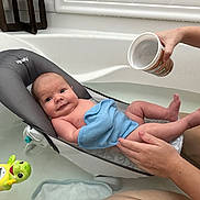 Jasper joined the competition — help win amazing prizes! baby, bathtub, bath, water, baby_bath_seat, towel, adult_hand, thermometer, toy, turtle, skin, infant, child, bathroom, floating_toy, relaxation, comfort, parenting, cleaning, care