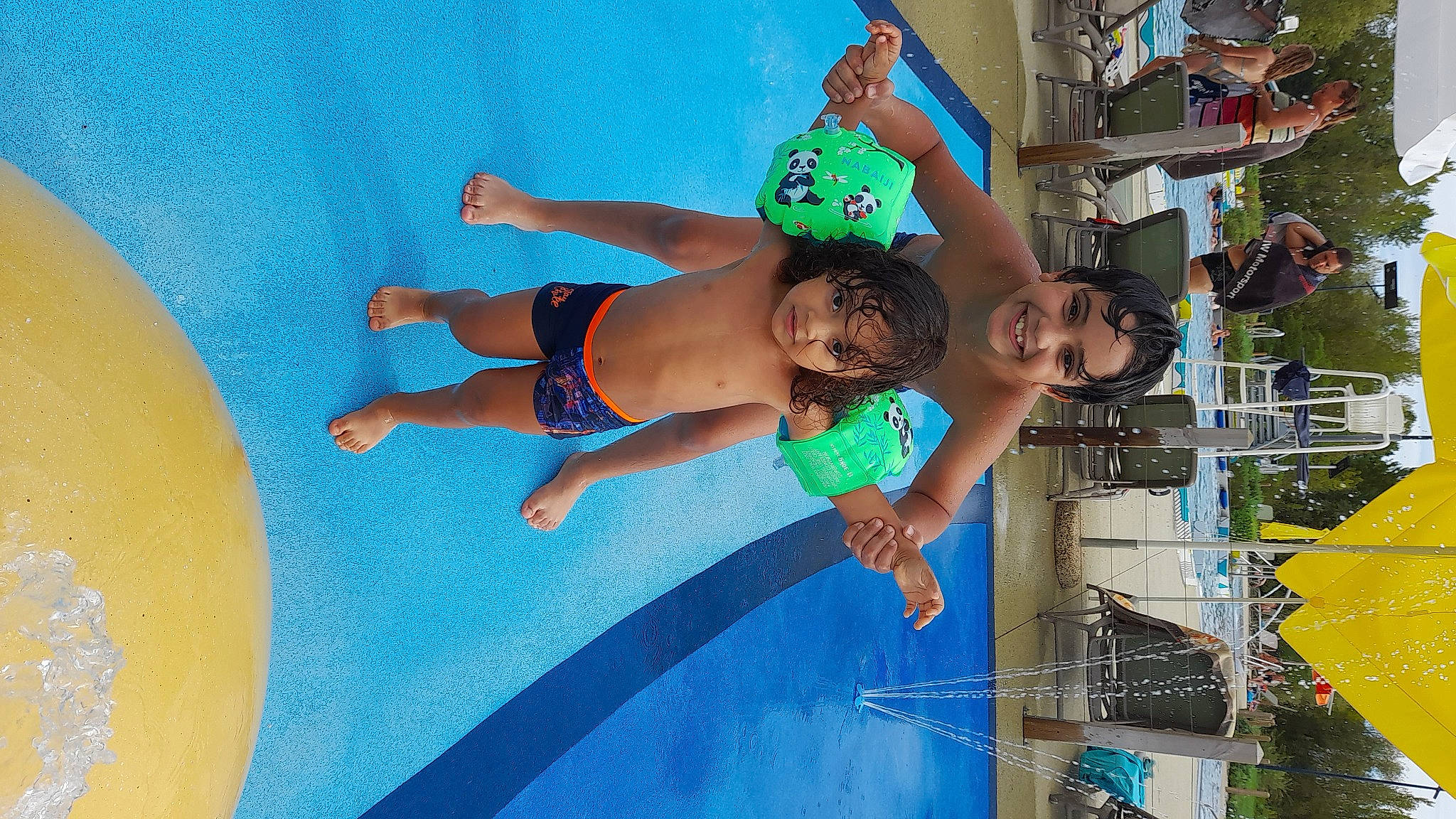 Rayan participe au concours pour gagner de l'argent avec cette photo : aqua, barefoot, chest, elbow, electric_blue, foot, fun, happy, human_leg, joy, knee, leisure, nonbuilding_structure, person, recreation, shorts, smile, swimming_pool, swimwear, thigh