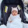 baby, blanket, bundle, car, car_seat, child, clothing, cozy, cute, expression, face, hat, infant, outdoor, person, portrait, safety, sitting, warm, winter_wear