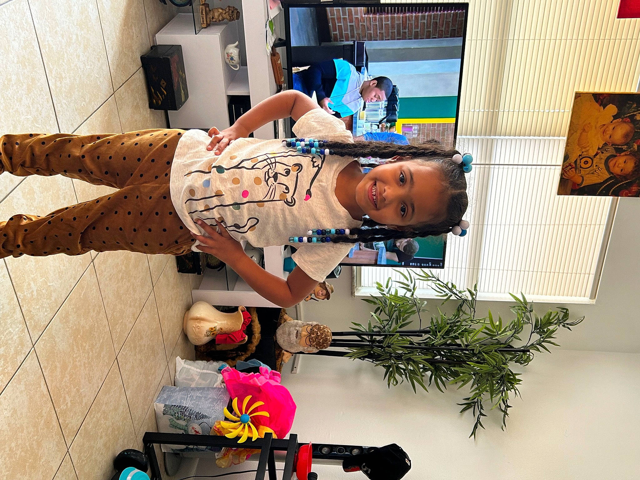 Mariyah joined the competition — help win amazing prizes! art, child, elbow, headwear, houseplant, human_leg, joy, person, plant, room, smile, t_shirt, thigh, tree, visual_arts, wrist