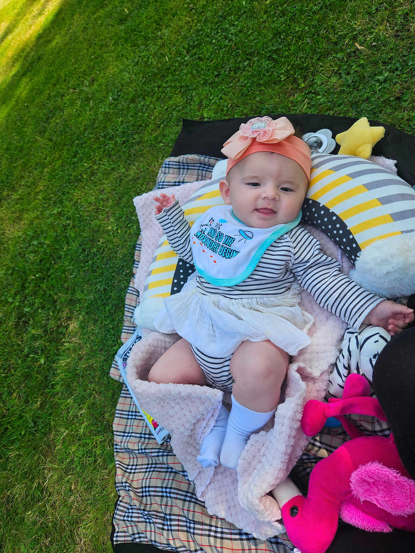 Eliora joined the competition — help win amazing prizes! baby, infant, striped_clothing, headband, flower, blanket, plush_toys, outdoor, grass, pillow, smiling, cute, toddler, cozy, playful, child, happy, soft_toy, sunny, relaxing