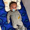 Alexander joined the competition — help win amazing prizes! baby, pacifier, onesie, pillow, animal_print, blanket, blue, pattern, striped_clothing, infant, lying_down, face, head, cute, indoors, sleeping_area, soft_toys, comfort, child, toddler
