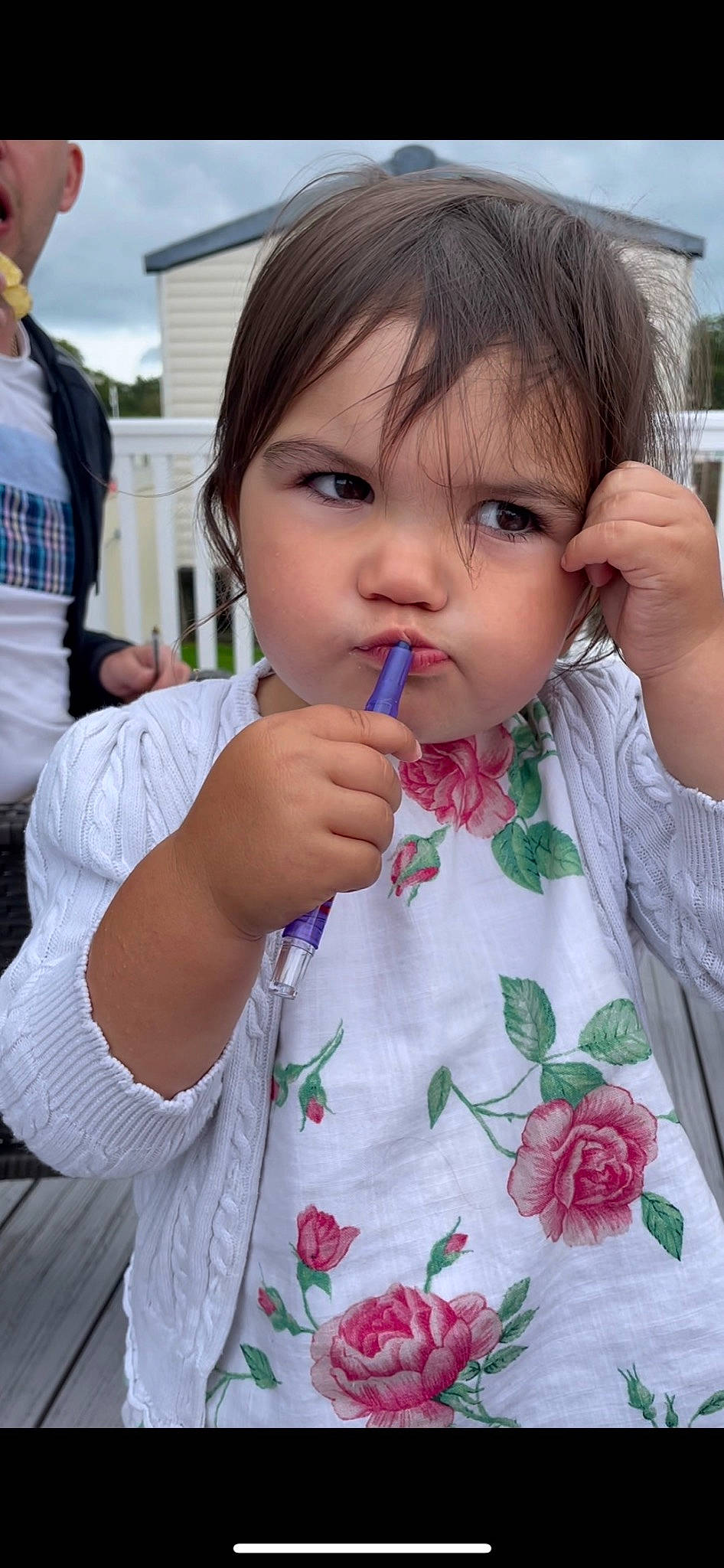 Ava Mae is registered to the contest to win money with this photo: cheek, child, chin, eyelash, facial_expression, finger, gesture, grass, hand, happy, human, lip, mouth, neck, nose, person, plant, skin, sleeve, t_shirt