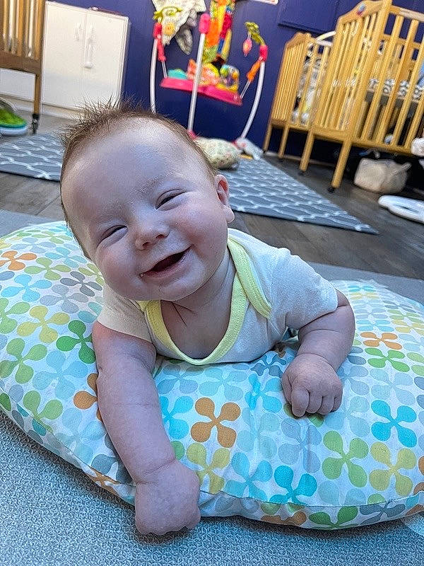 Lux joined the competition — help win amazing prizes! baby, baby_products, baby_toddler_clothing, cheek, child, comfort, eye, flooring, fun, grass, happy, iris, joy, pattern, person, room, sitting, skin, sleeve, smile