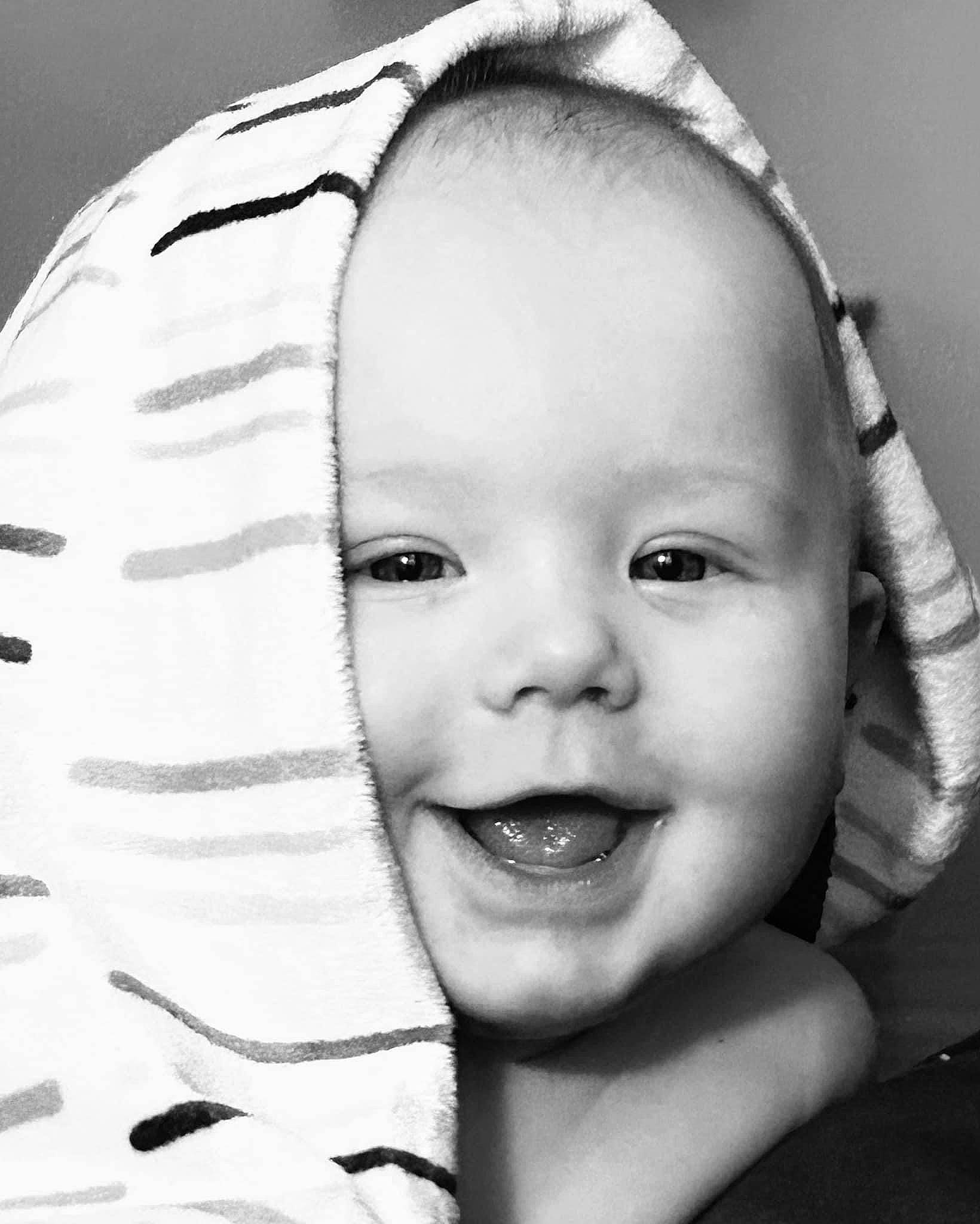 Lux is registered to the contest to win money with this photo: black, black_and_white, cheek, chin, eye, eyebrow, eyelash, face, flash_photography, happy, head, iris, lip, mouth, nose, person, skin, smile, style, toddler