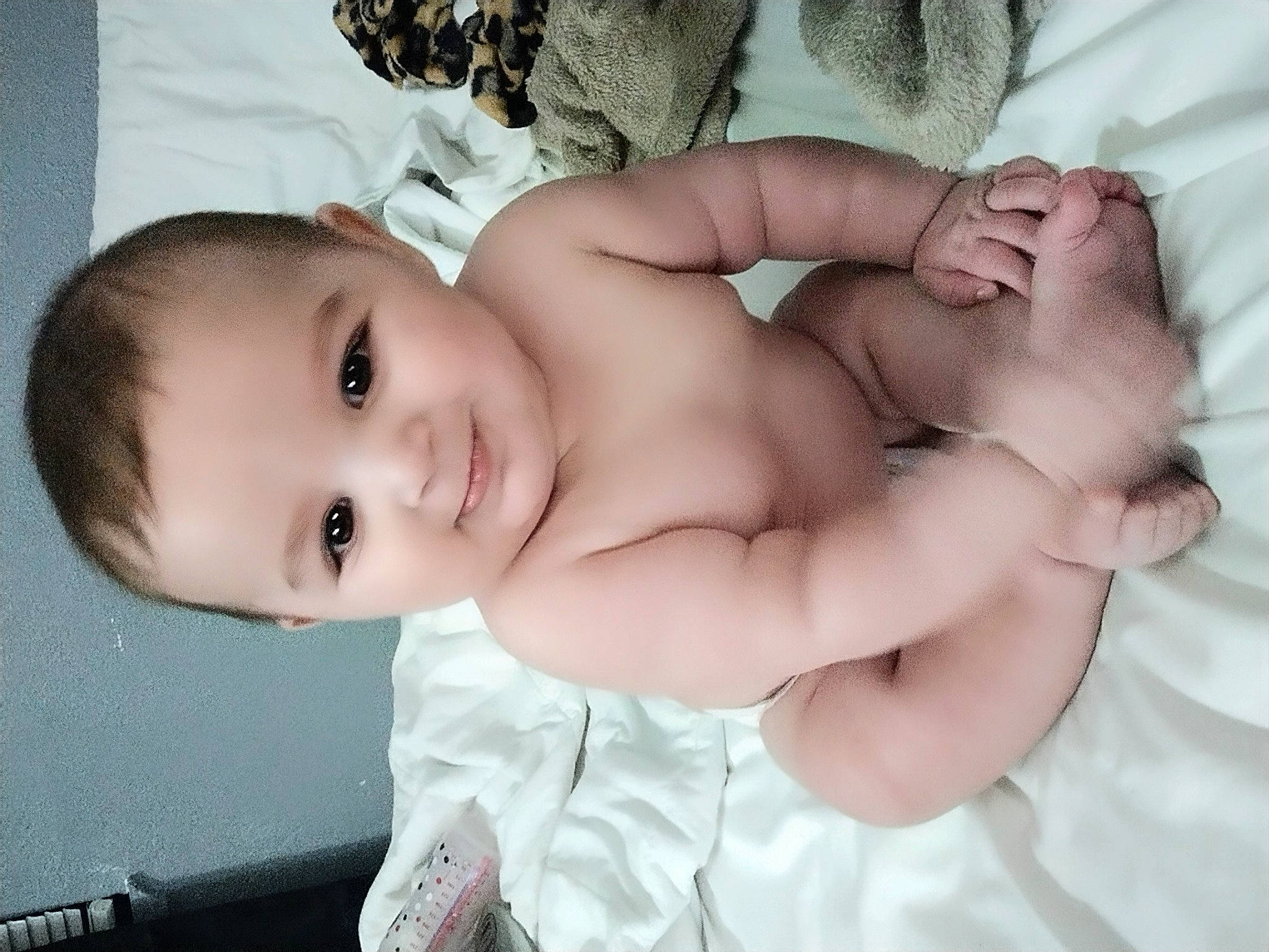 Sterling is registered to the contest to win money with this photo: abdomen, baby, baby_sleeping, baby_toddler_clothing, cheek, chest, comfort, eyebrow, eyelash, flash_photography, gesture, happy, human_body, joy, lip, mouth, nose, person, skin, smile