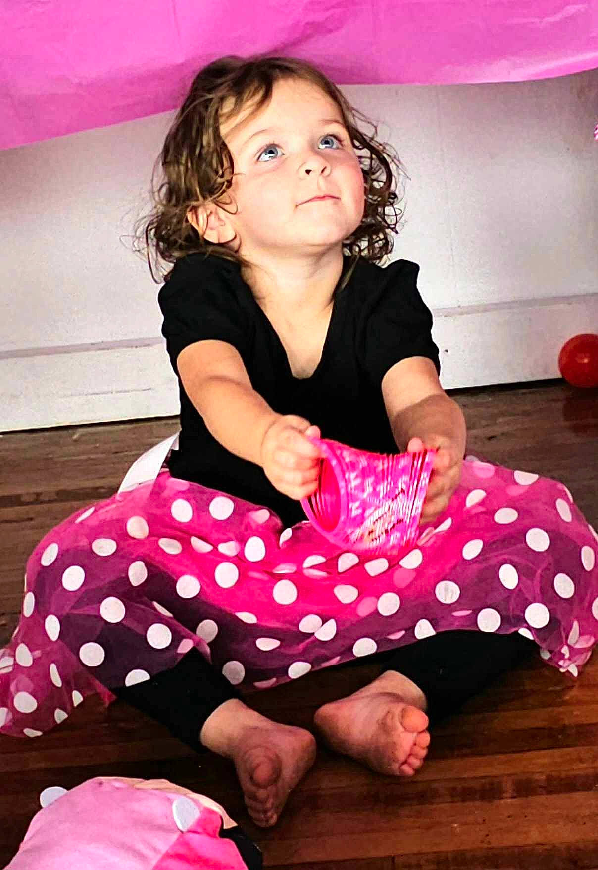 Ember is registered to the contest to win money with this photo: baby_toddler_clothing, barefoot, beauty, child, facial_expression, flash_photography, fun, hairstyle, happy, knee, magenta, neck, pattern, person, pink, shoulder, sleeve, thigh, toddler, waist