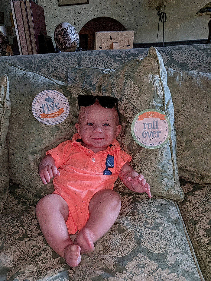 Seamus joined the competition — help win amazing prizes! boy, child, eye, fun, girl, infant, joy, person, pink, sitting, skin, smile, temple, toddler, vacation