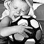 child, toddler, baby, hat, soccer_ball, water, pool, smile, closed_eyes, hand, playing, summer, outdoor, cute, fun, joy, black_and_white, portrait, happy, sunlight