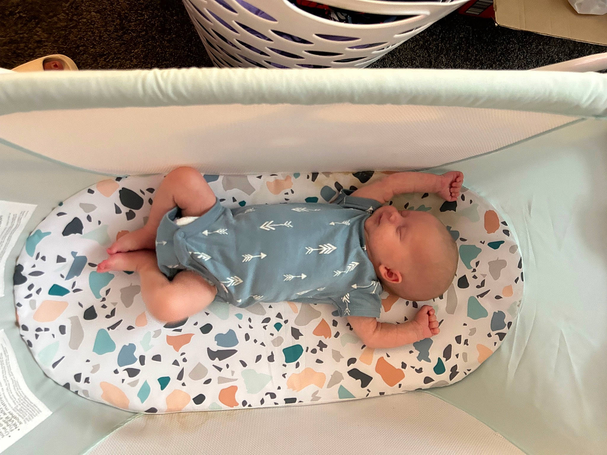 Hudson is registered to the contest to win money with this photo: baby, baby_products, baby_toddler_clothing, child, comfort, dishware, linens, pattern, person, room, serveware, sleeve, tableware, textile, thigh, toddler, white