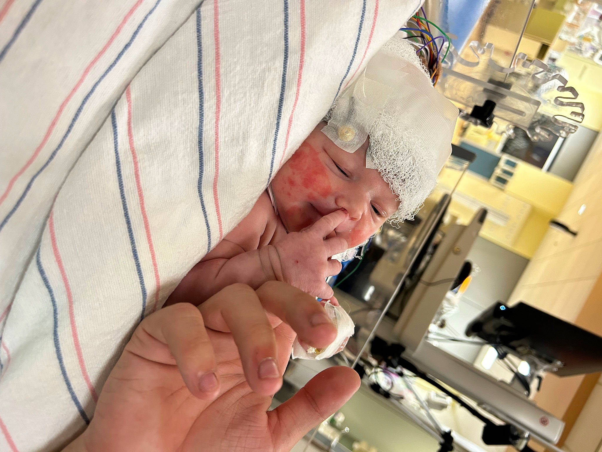 Hudson is registered to the contest to win money with this photo: auto_part, engineering, finger, hand, headwear, job, machine, metal, nail, office_equipment, person, room, service, thumb, wrinkle, wrist