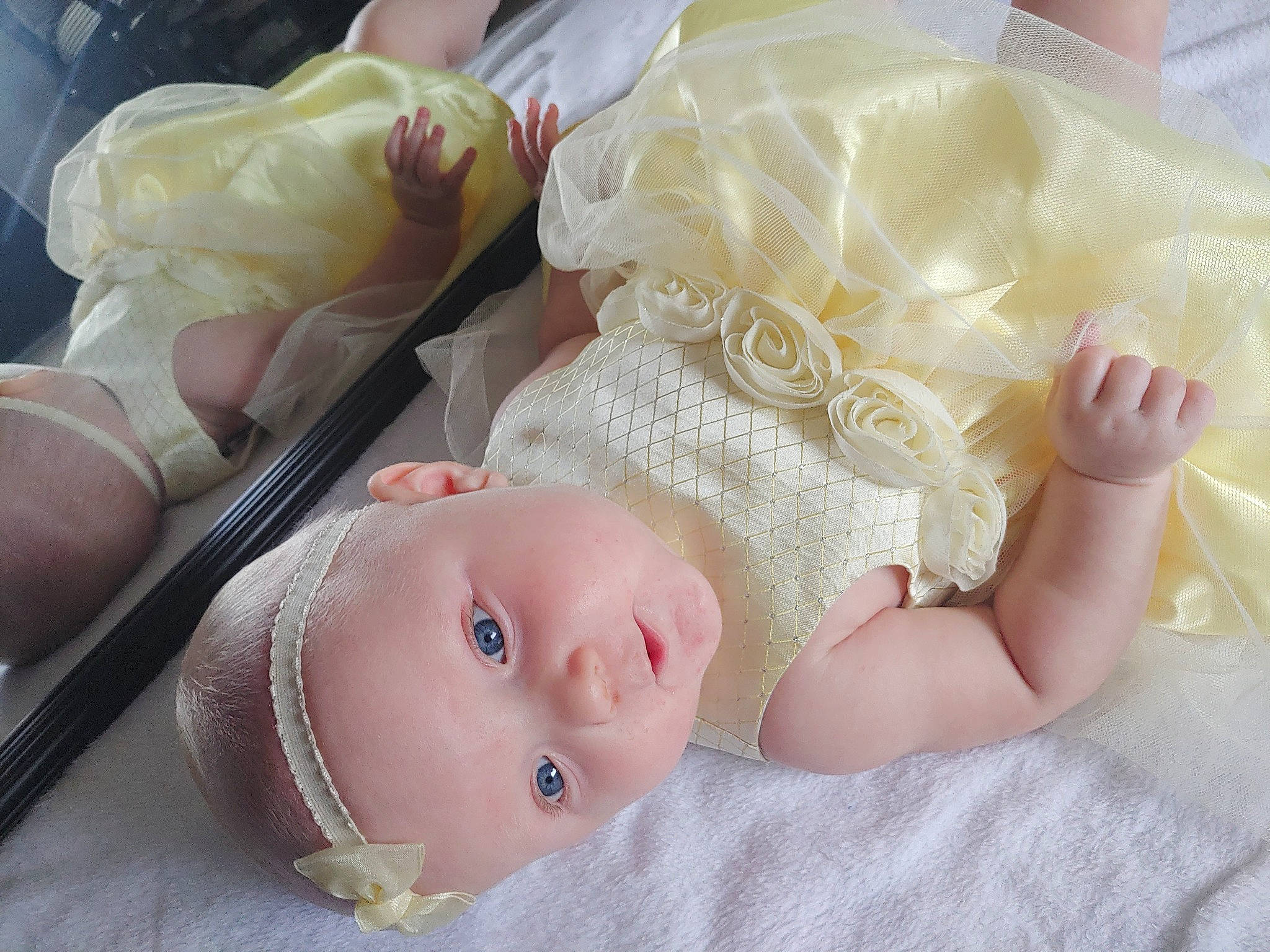 Kenzie joined the competition — help win amazing prizes! baby, baby_sleeping, baby_toddler_clothing, cheek, child, comfort, dress, eyelash, fashion_accessory, grass, hair_accessory, headgear, lip, nail, pattern, peach, person, pink, product, skin