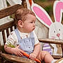 baby, child, carrot, wooden_chair, overalls, cute, outdoor, easter, bunny_cutout, spring, smile, shoes, socks, portrait, funny_expression, nature, holiday, decoration, face, person