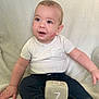 Cassidy is registered to the contest to win money with this photo: baby, child, infant, sitting, plush_block, clothing, white_shirt, denim_pants, blanket, face, smile, lipstick_marks, cute, indoors, soft_texture, hand, foot, portrait, happy, young