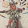 baby, infant, leopard_print, robe, slippers, makeup_brush, foundation, cosmetics, white_sheet, sign, 1_month, face, hand, foot, lying_down, cute, newborn, headband, soft_texture, skin