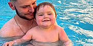 Tymeo participe au concours pour gagner de l'argent avec cette photo : adult, baby, background, blue, child, family, father, happy, love, man, outdoor, parent, pool, skin, smiling, splashing, summer, swimming, toddler, water