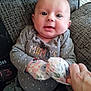 Bailey Lee is registered to the contest to win money with this photo: baby, blue_eyes, child, closeup, couch, cozy, cute, gray_clothing, hand, happy, indoor, infant, mittens, person, polka_dots, portrait, seated, smiling, soft_lighting, textured_fabric