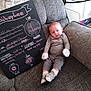 Bailey Lee joined the competition — help win amazing prizes! baby, child, clothing, couch, cozy, cute, furniture, gray, handwriting, home_interior, indoors, infant, milestone_board, mittens, polka_dot, portrait, sitting, soft, textile, young_child