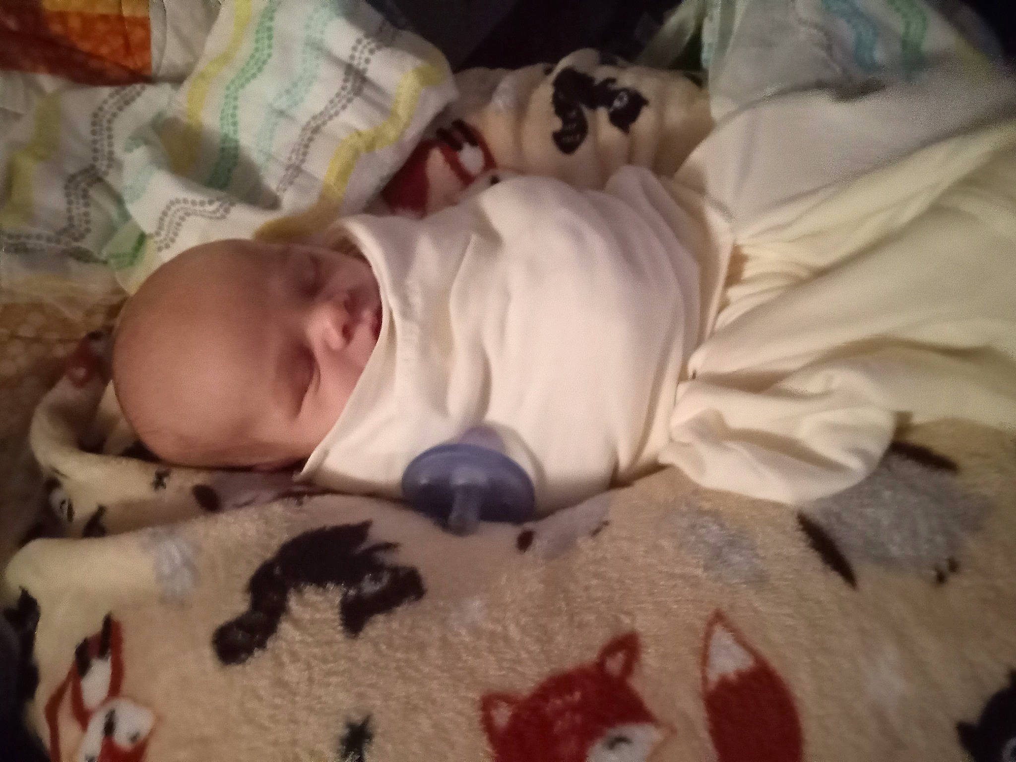 Maddox is registered to the contest to win money with this photo: baby, baby_products, baby_toddler_clothing, bedding, bedtime, cheek, child, comfort, linens, nap, person, room, sleep, textile, toddler