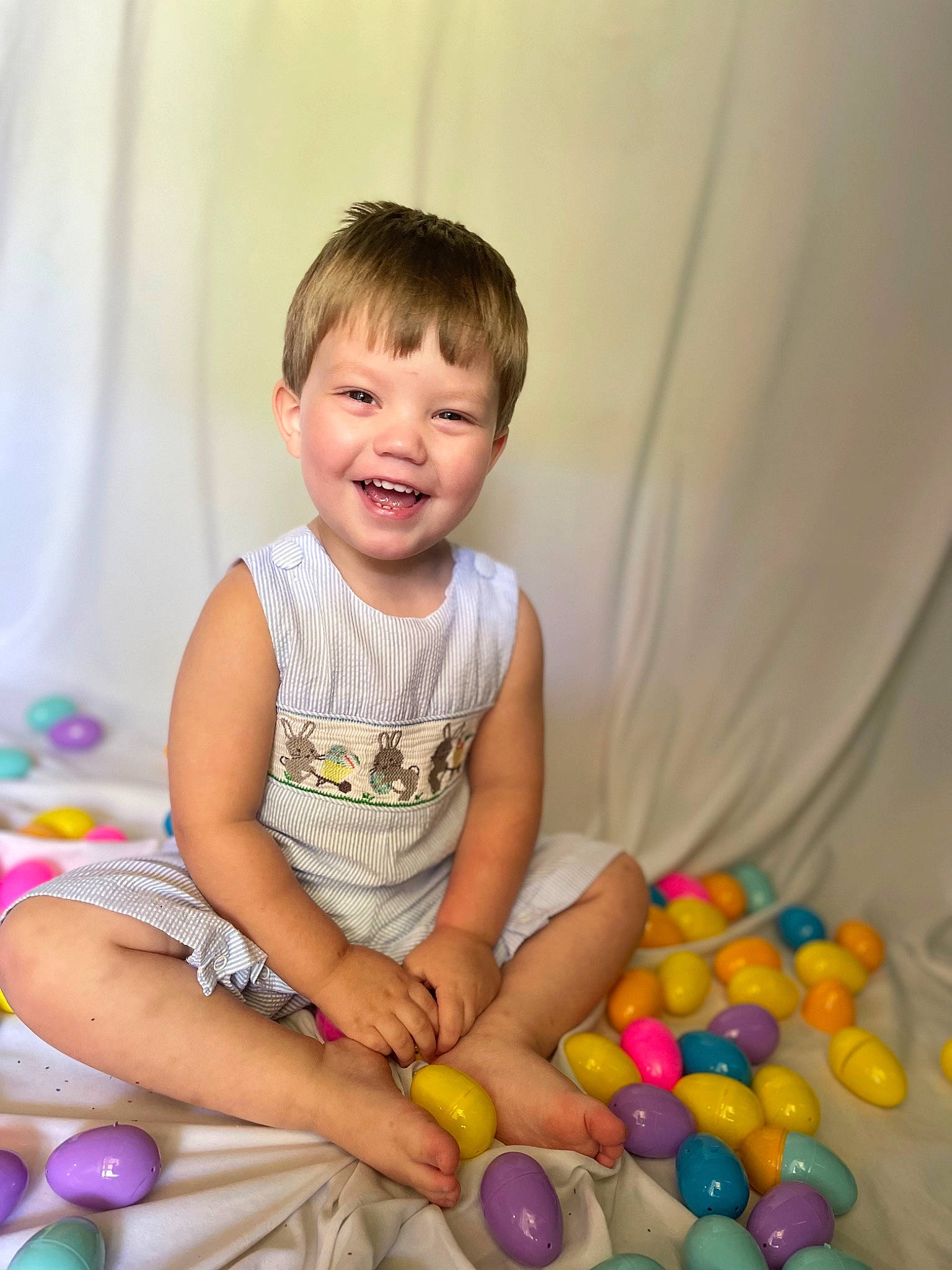Brandon is registered to the contest to win money with this photo: baby, baby_playing_with_toys, baby_toddler_clothing, baby_toys, ball_pit, child, event, fun, happy, joy, leisure, party, party_supply, person, plastic, play, room, sitting, smile, sweetness