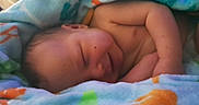 Griffin joined the competition — help win amazing prizes! baby, newborn, sleeping, smiling, blanket, cozy, infant, soft, cute, peaceful, child, wrapped, skin, resting, warm, comfort, portrait, closeup, toddler, happy