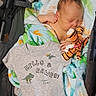 Griffin joined the competition — help win amazing prizes! newborn, baby, blanket, stroller, plush_toy, tiger, onesie, dinosaur_print, sleeping, infant, clothing, cute, cozy, child, resting, soft, fabric, indoor, person, baby_girl_or_boy