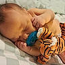 Griffin joined the competition — help win amazing prizes! baby, sleeping, pacifier, stuffed_tiger, bed, blanket, infant, child, cute, peaceful, hand, face, foot, soft_toy, indoor, resting, cozy, bedroom, comfort, young