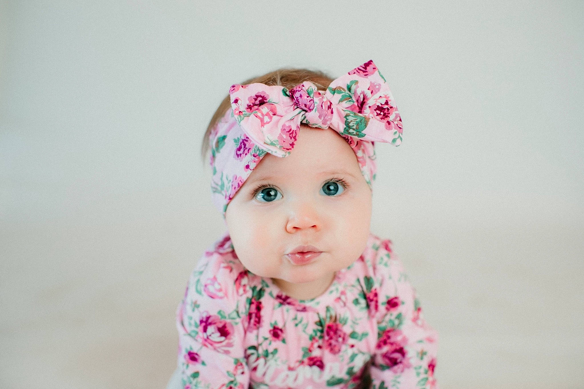 Brynn joined the competition — help win amazing prizes! baby, baby_toddler_clothing, beanie, cap, cheek, child, eyelash, face, fashion_accessory, hair_accessory, happy, headpiece, headwear, knit_cap, lip, magenta, outerwear, pattern, person, pink