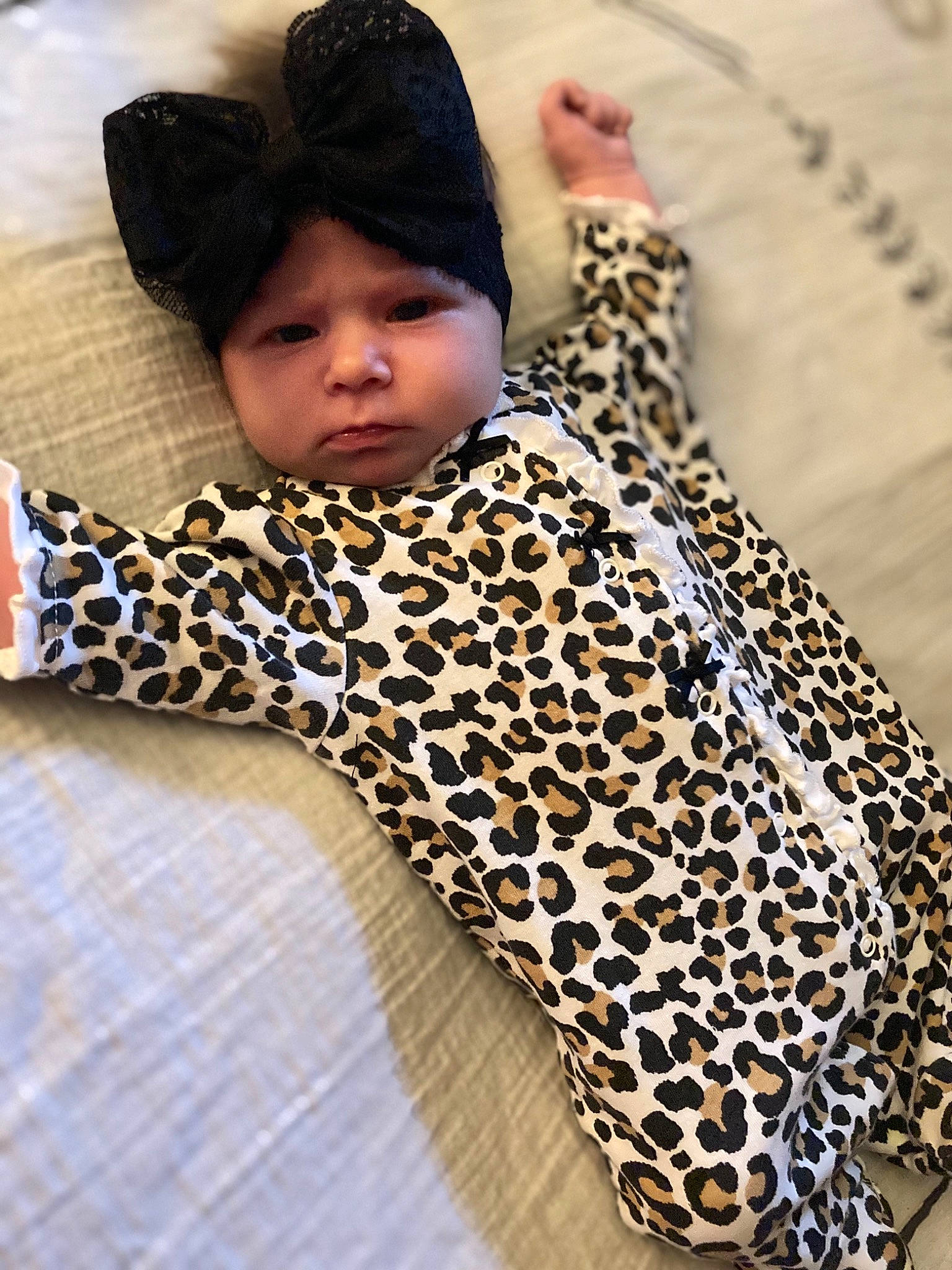 Harlee joined the competition — help win amazing prizes! baby, baby_sleeping, baby_toddler_clothing, comfort, dress, fashion_accessory, flooring, fur, grass, headgear, headwear, human_leg, leg, linens, outerwear, pattern, person, sleeve, thigh, toddler