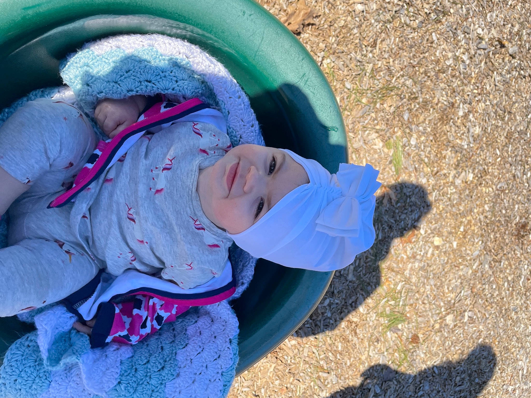 Juliana joined the competition — help win amazing prizes! blue, child, electric_blue, freezing, fun, grass, hat, headwear, landscape, leisure, magenta, people_in_nature, person, plant, play, recreation, sitting, soil, tints_and_shades, toddler