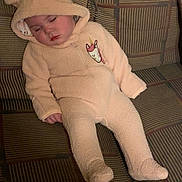 Adalynn is registered to the contest to win money with this photo: baby, bodypart, bonnet, cap, clothing, costume, couch, cushion, face, finger, furniture, glove, hat, head, homedecor, newborn, person, photography, portrait, sleeping