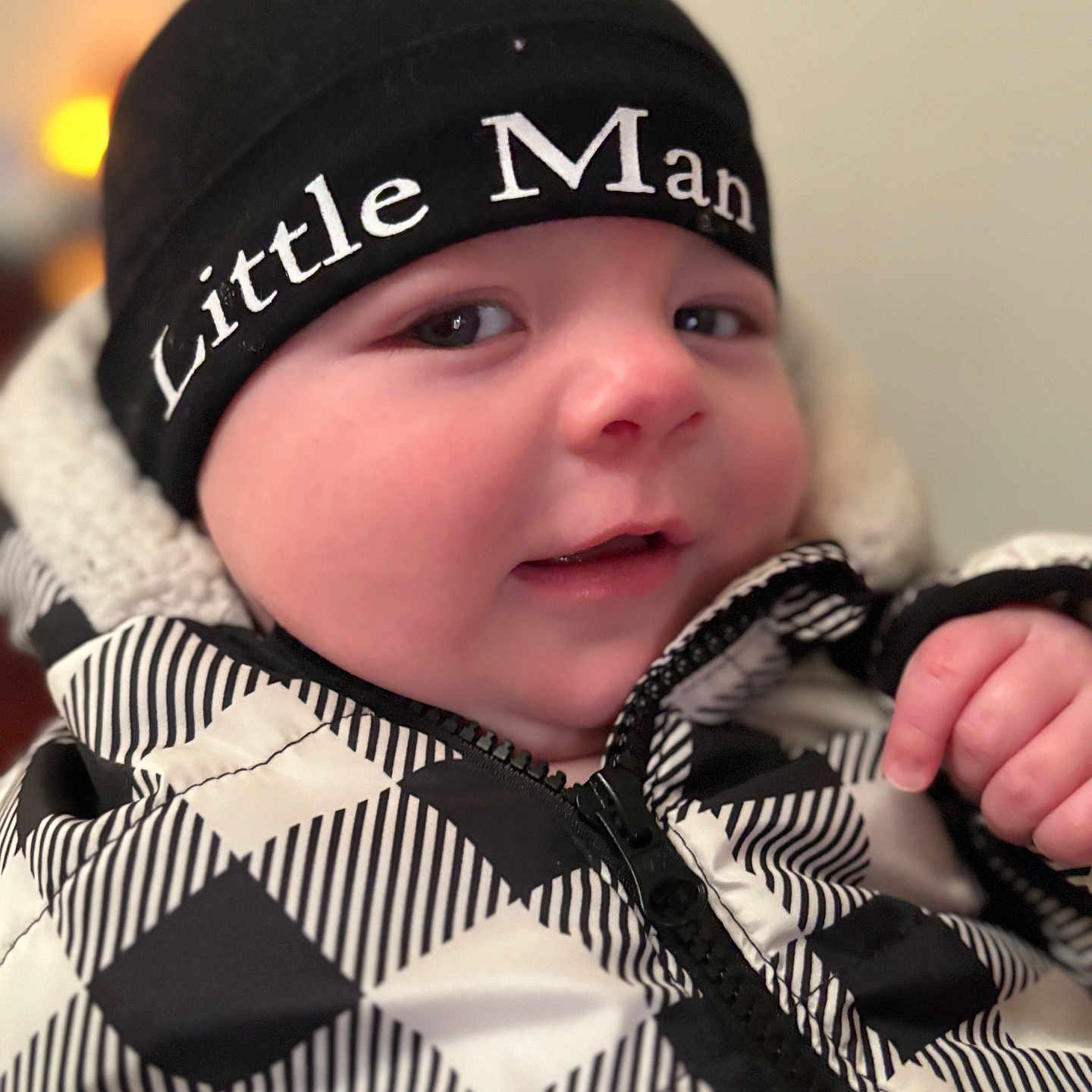 Jayden is registered to the contest to win money with this photo: baby, beanie, bodypart, bonnet, cap, clothing, coat, face, finger, hand, hat, head, hood, hoodie, jacket, knitwear, person, photography, sweater, sweatshirt