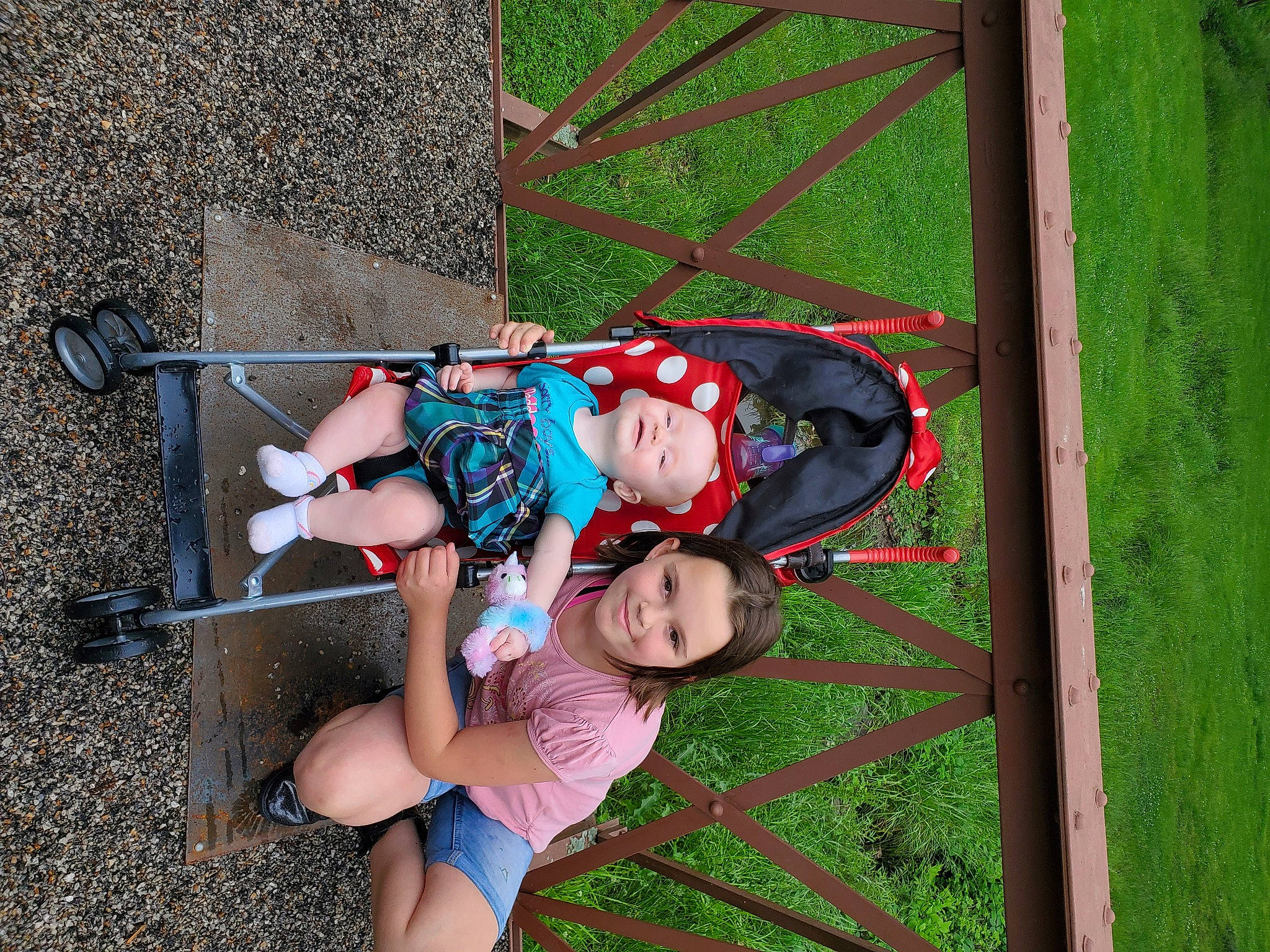 Trinity is registered to the contest to win money with this photo: baby, baby_products, baby_toddler_clothing, child, fun, grass, happy, hat, joy, leisure, magenta, outdoor_play_equipment, people_in_nature, person, plant, recreation, sandal, smile, thigh, toddler