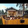 dog, fence, house, porch, outdoor, sunset, sky, tree, mailbox, residential, yard, plants, walkway, window, suburban, wood, animal, pet, daytime, neighborhood