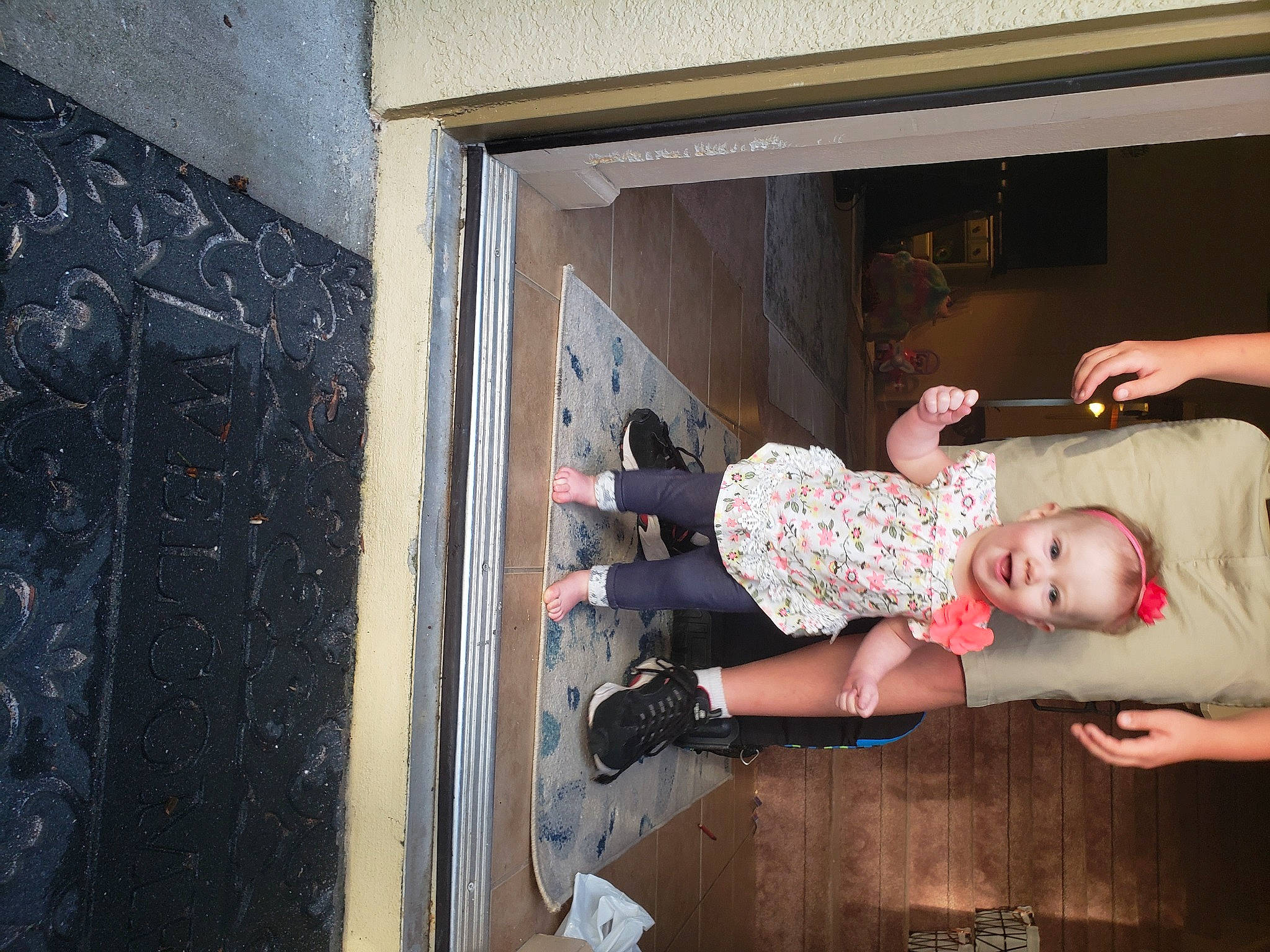 Avery is registered to the contest to win money with this photo: baby, baby_products, baby_toddler_clothing, boot, child, concrete, floor, flooring, fun, hardwood, hat, human_leg, joy, knee, person, room, sandal, sitting, sock, thigh