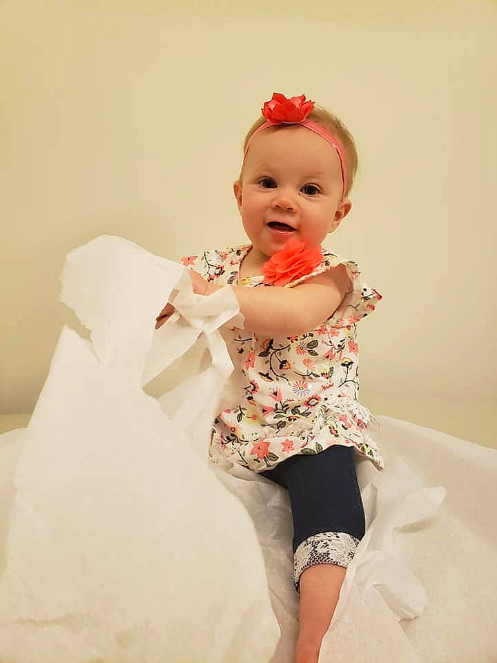 Avery is registered to the contest to win money with this photo: baby, baby_toddler_clothing, event, fashion_design, finger, flash_photography, flooring, happy, human_leg, knee, lip, peach, person, pink, skin, sleeve, smile, thigh, thumb, toddler