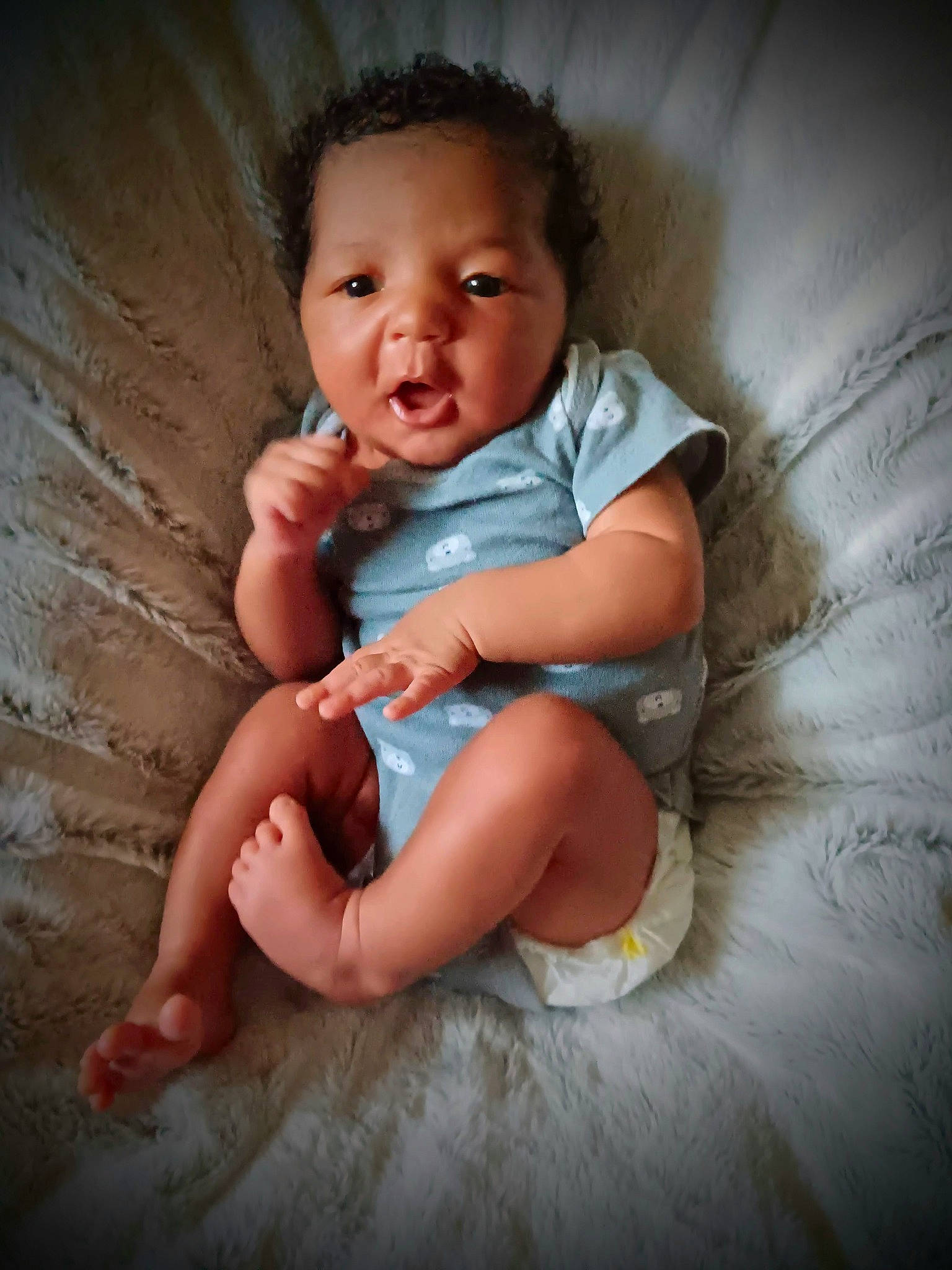 Dominique is registered to the contest to win money with this photo: baby, baby_toddler_clothing, cheek, chin, comfort, elbow, finger, flash_photography, fun, happy, human_leg, iris, leg, lip, mouth, nose, person, skin, stomach, toddler