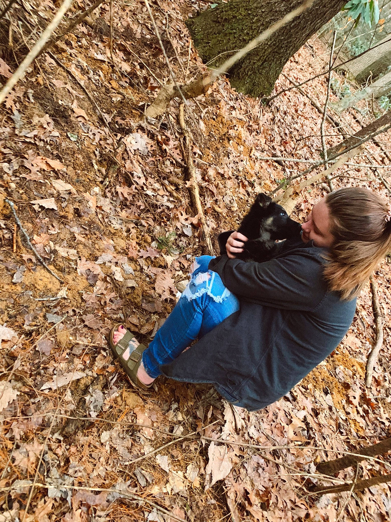 Zane is registered to the contest to win money with this photo: autumn, boot, branch, deciduous, forest, fun, grass, leisure, people_in_nature, play, recreation, rock, sitting, soil, tree, twig, winter, wood, woodland, woody_plant