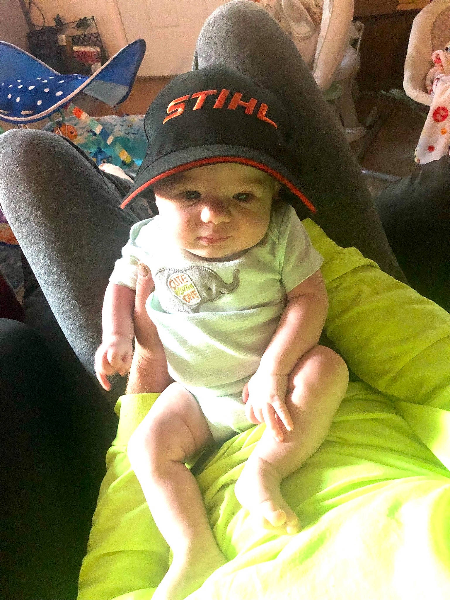 Orin joined the competition — help win amazing prizes! auto_part, baby, baby_products, baby_toddler_clothing, baseball_cap, cap, car_seat, chair, child, comfort, fashion_accessory, fun, happy, hat, headwear, human_leg, lap, leisure, person, sitting