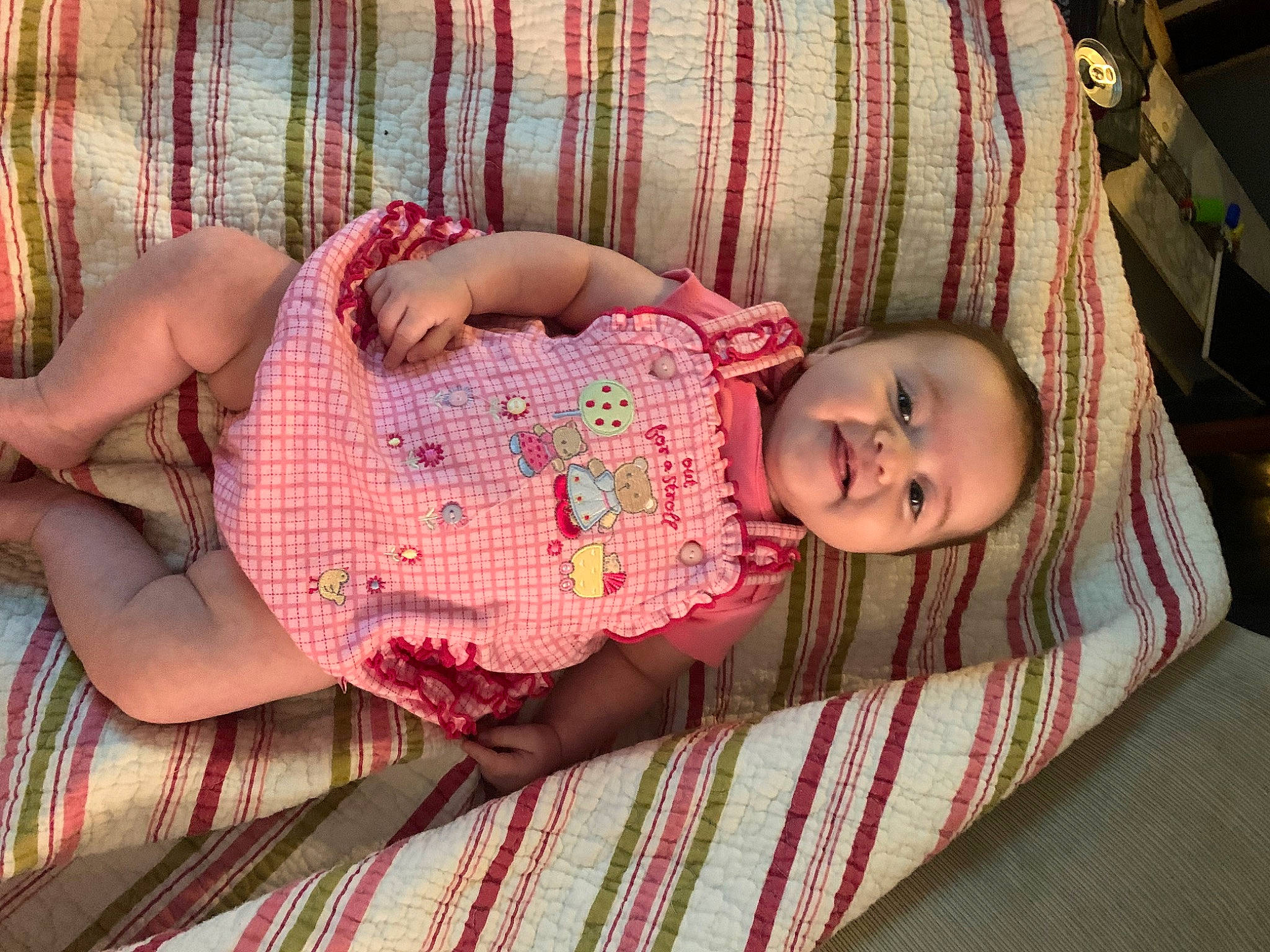 Rylee joined the competition — help win amazing prizes! baby, baby_products, baby_toddler_clothing, bedding, child, comfort, flooring, human_body, linens, magenta, pattern, person, pink, plaid, red, room, skin, tartan, textile, toddler