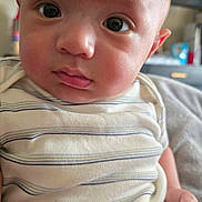 Vincenzo joined the competition — help win amazing prizes! baby, infant, close_up, face, eyes, onesie, striped_clothing, indoor, person, child, cute, skin, head, expression, hand, young, portrait, newborn, chubby_cheeks, curious