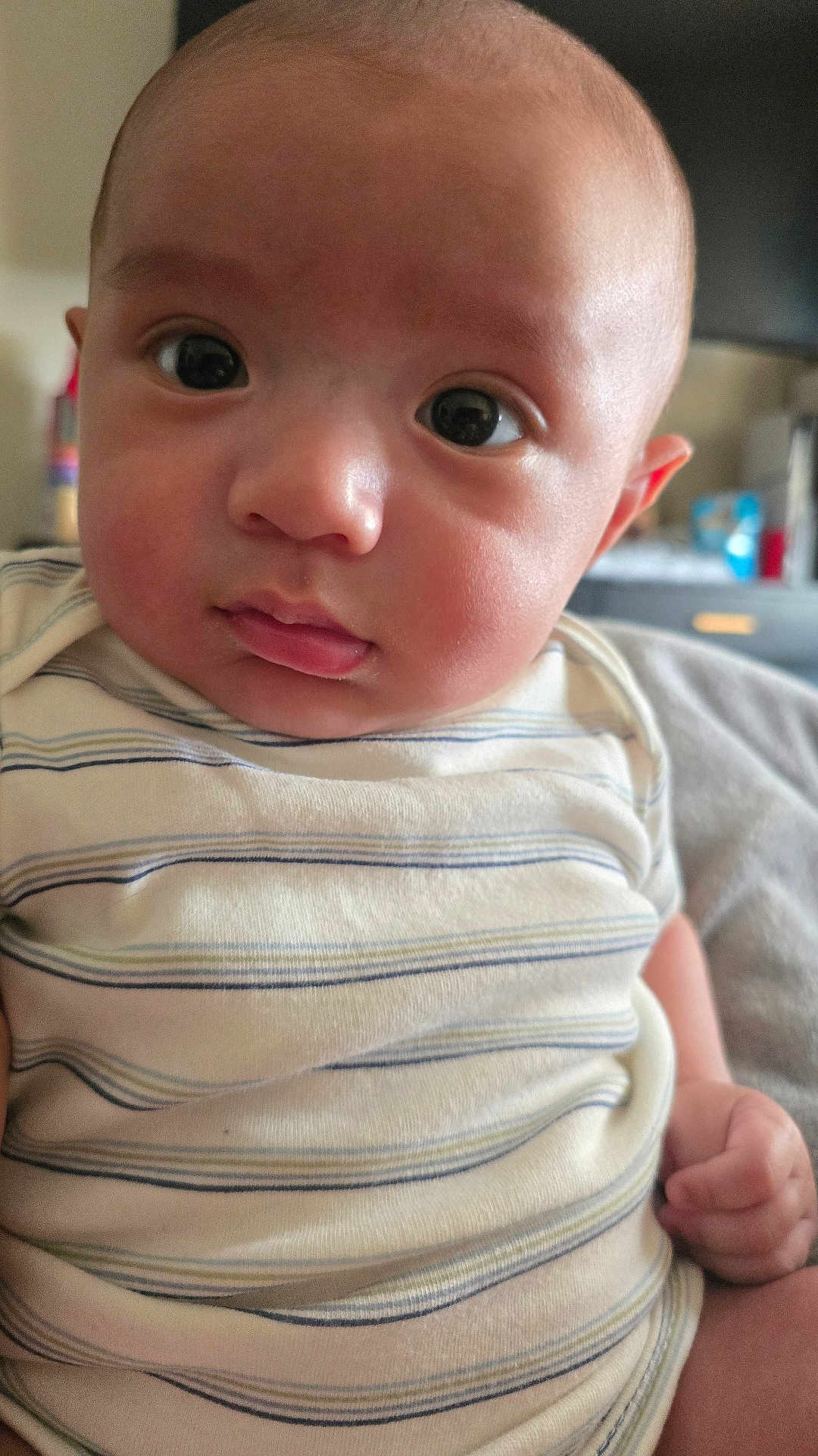 Vincenzo joined the competition — help win amazing prizes! baby, infant, close_up, face, eyes, onesie, striped_clothing, indoor, person, child, cute, skin, head, expression, hand, young, portrait, newborn, chubby_cheeks, curious