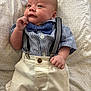 Noah joined the competition — help win amazing prizes! baby, infant, clothing, bow_tie, suspenders, shirt, shorts, bedspread, pattern, face, hand, cute, posing, resting, indoors, child, newborn, portrait, fashion, young
