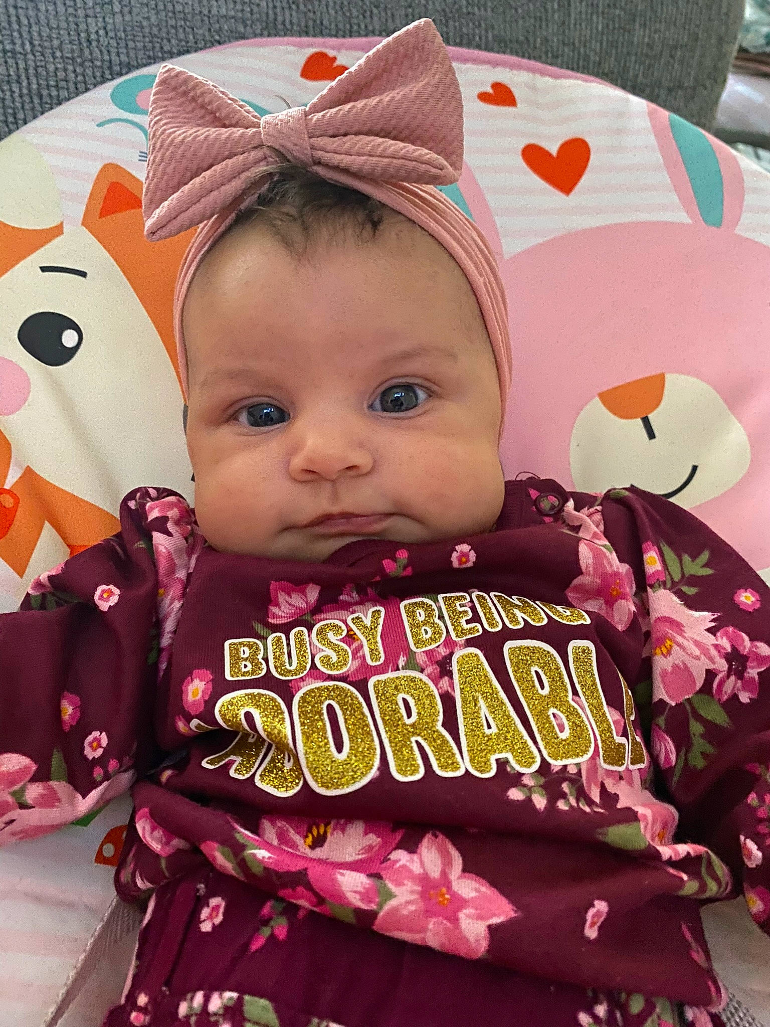 Phoenix joined the competition — help win amazing prizes! baby, baby_products, baby_toddler_clothing, beauty, birthday, cap, child, event, face, facial_expression, fashion_accessory, happy, magenta, pattern, person, petal, pink, skin, sleeve, sugar_cake