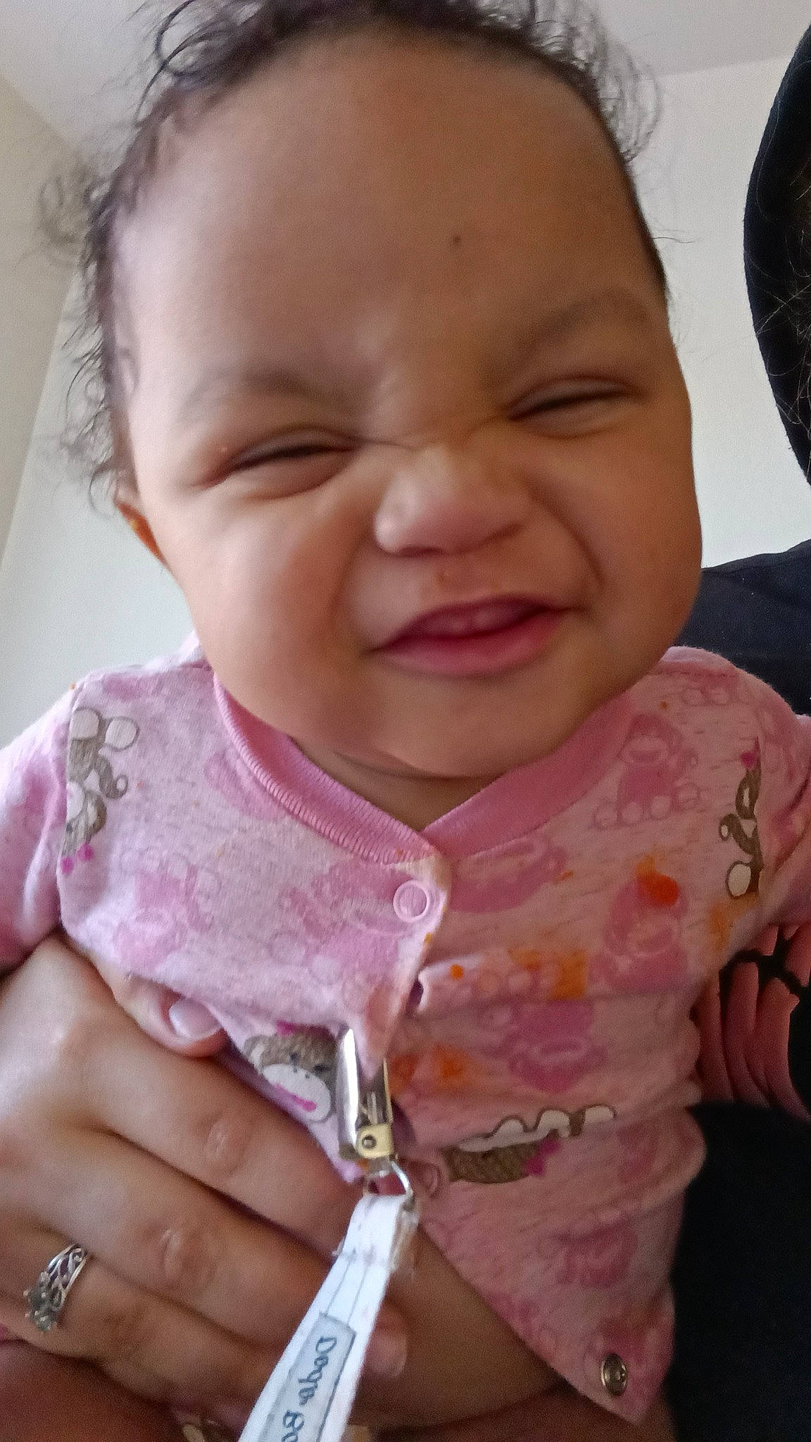 Adara is registered to the contest to win money with this photo: baby, baby_toddler_clothing, cheek, eye, eyebrow, eyelash, finger, gesture, happy, iris, lip, mouth, neck, nose, person, pink, skin, sleeve, smile, thumb