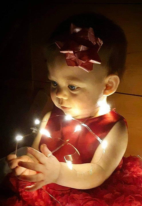 Sofia Eve joined the competition — help win amazing prizes! baby, candle, child, christmas, ear, fun, hand, holiday, human, human_body, interior_design, light, lighting, person, toddler
